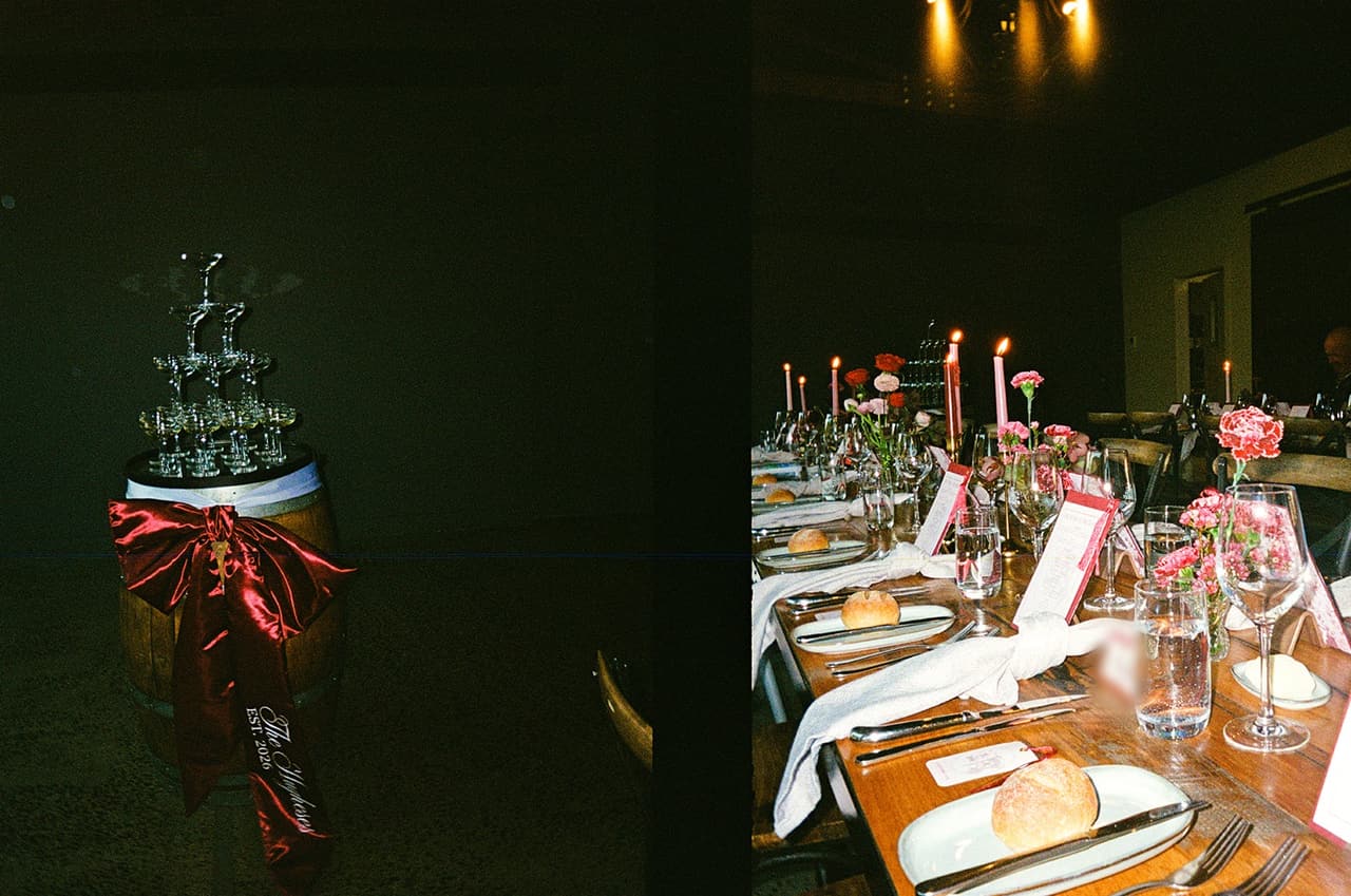 Two half frames side by side: the champagne tower glasses on a wine barrel tied with a burgundy bow, and a long table set with candles, carnations and bread rolls, on 35mm film