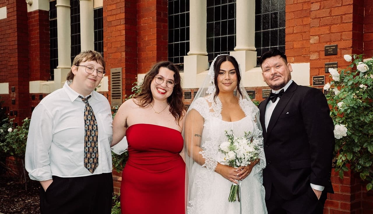 Ashley and Bryan with two friends outside the church