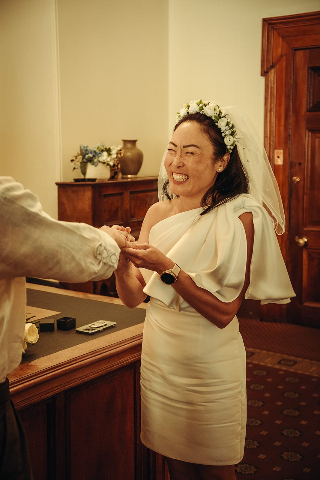 Cecile beaming as she slides the ring onto Stefan’s finger