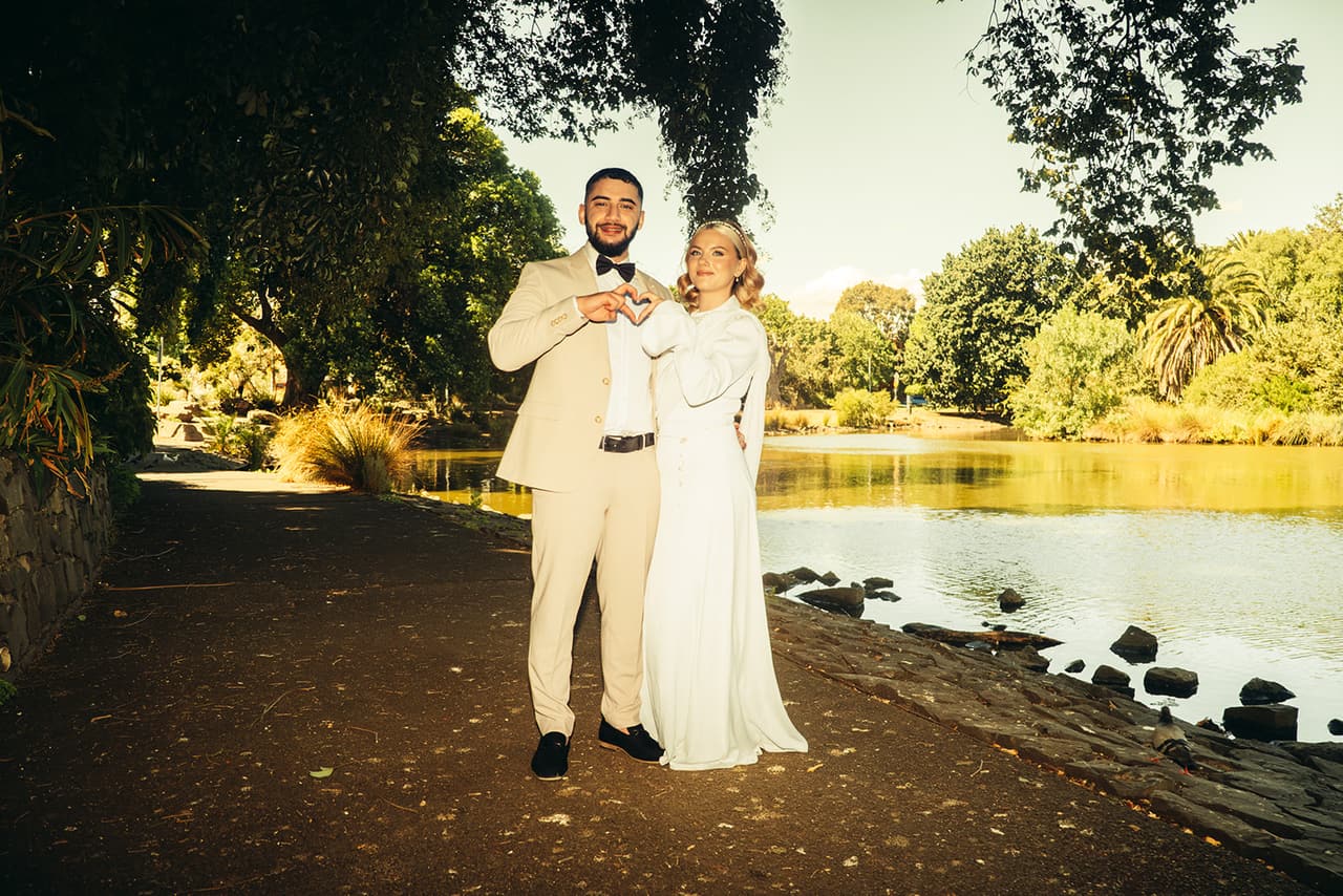 Elektra and Yasir at the edge of the lake in the afternoon sun