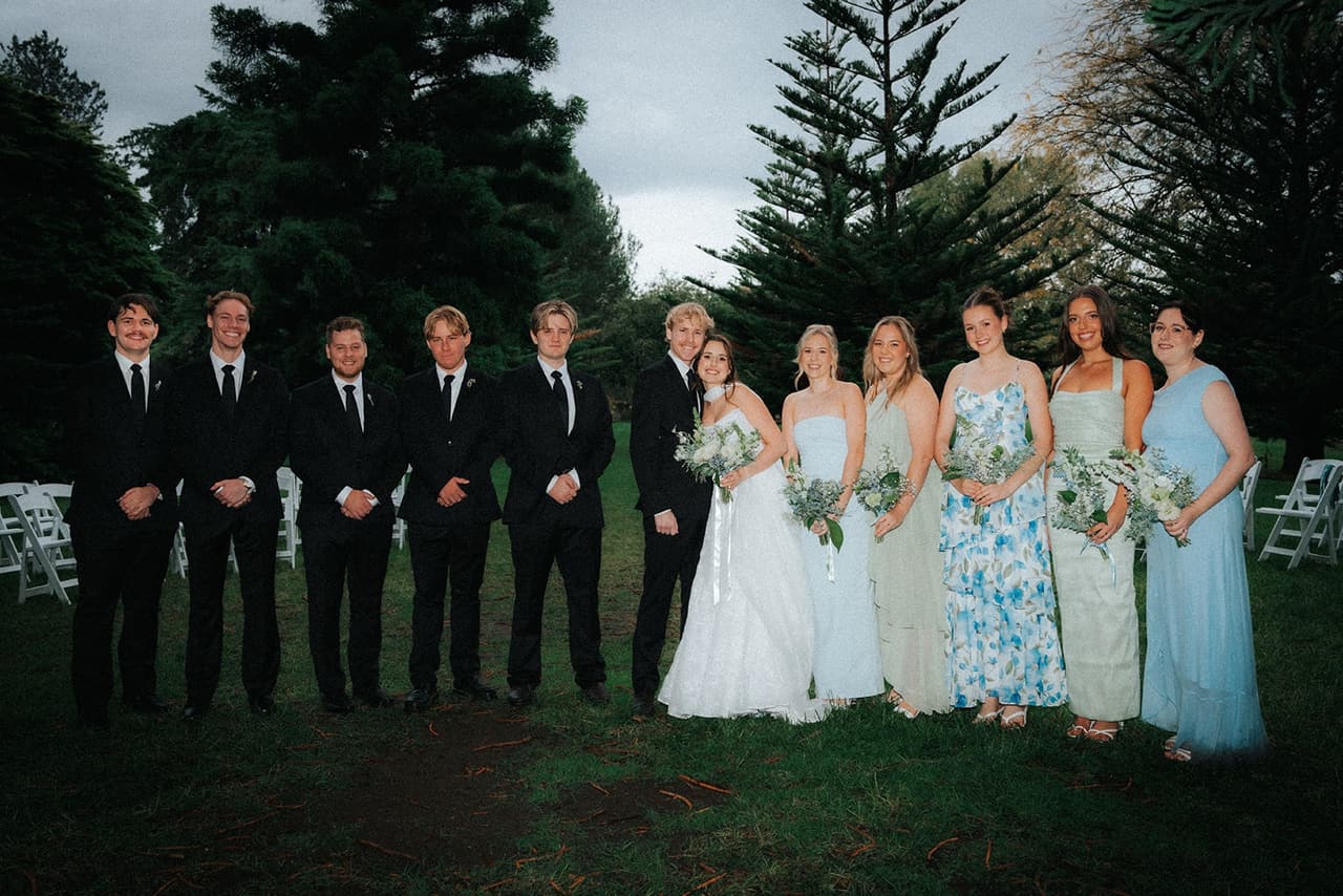 The full bridal party lined up on the lawn after the ceremony
