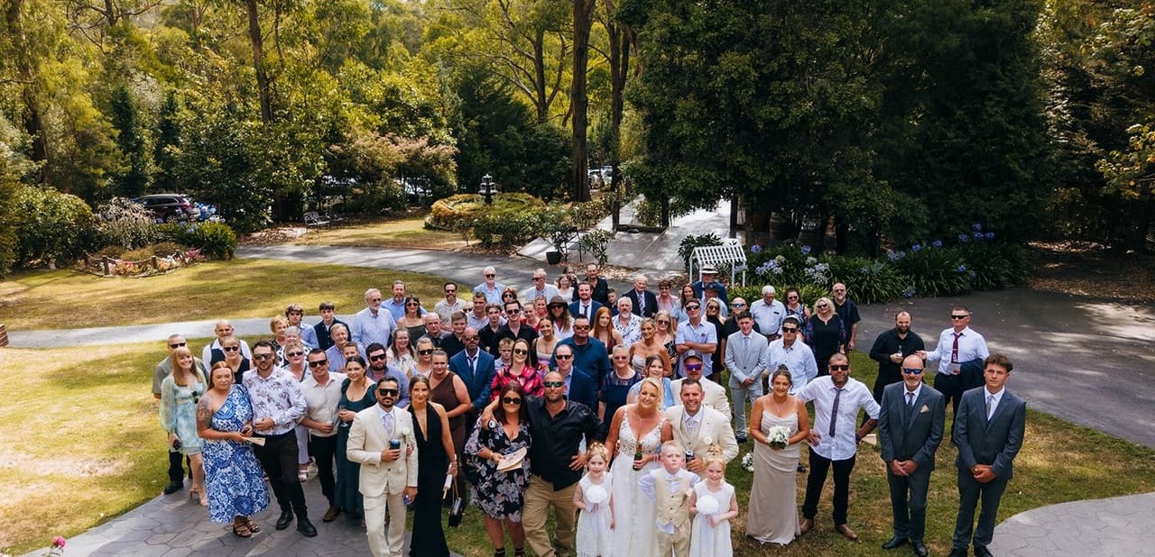 Every guest gathered on the castle lawn for one group photo, taken from above