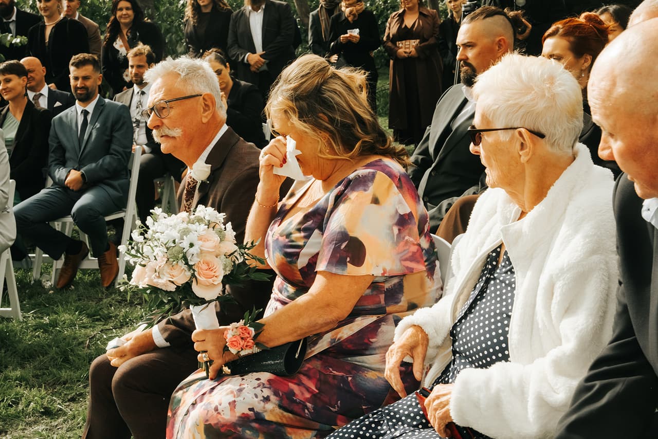 Jessica’s mum wiping away a tear in the front row, the bouquet in her lap