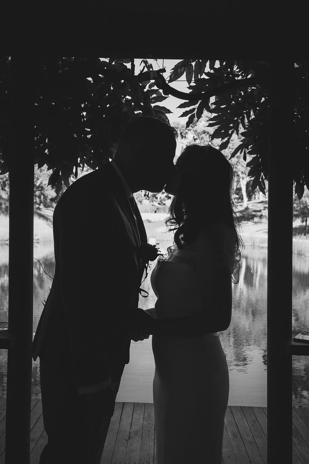 Black and white photo of Kim and Ben in silhouette, framed in a doorway