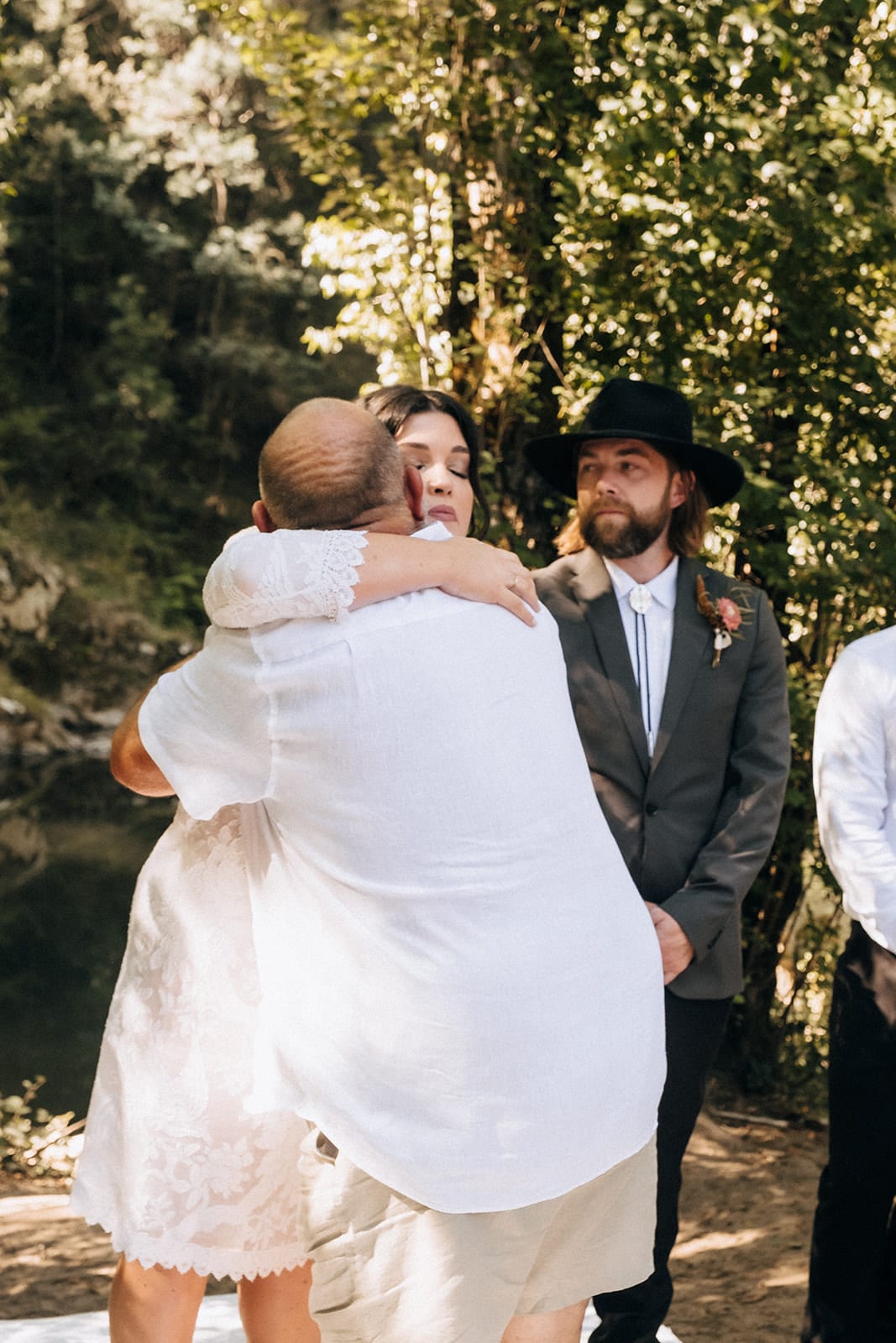 Lana’s dad hugging her at the front of the ceremony as Todd waits beside them