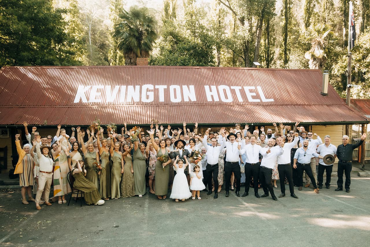 Everyone cheering together in front of the Kevington Hotel