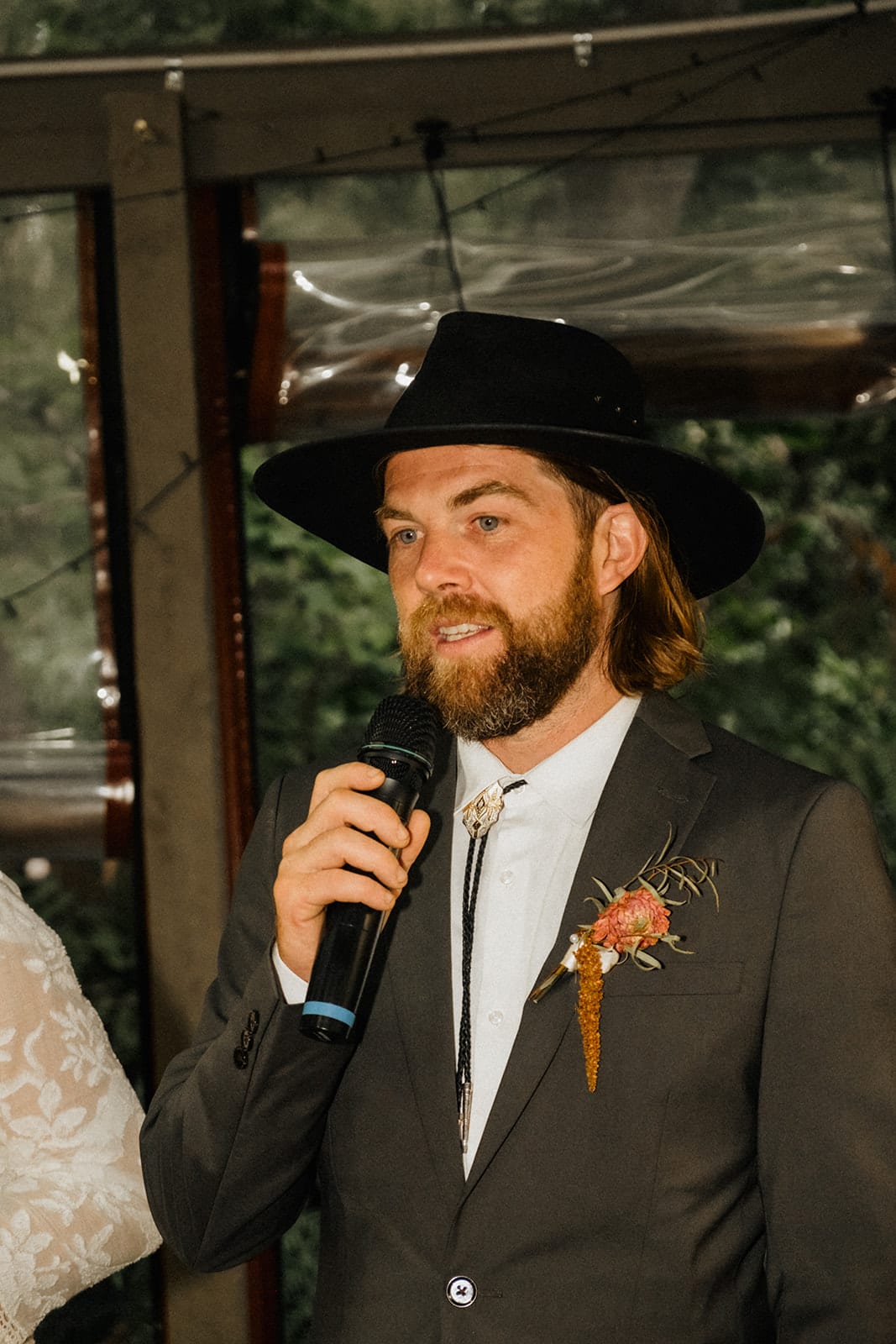 Todd giving his speech, microphone in hand