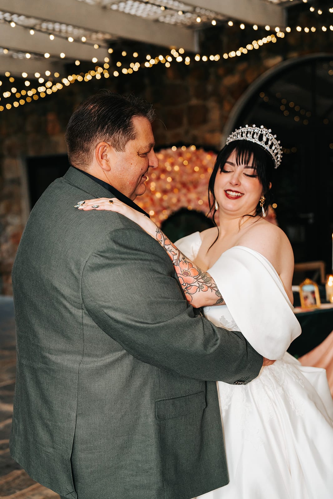 Porscha laughing as she dances with her dad