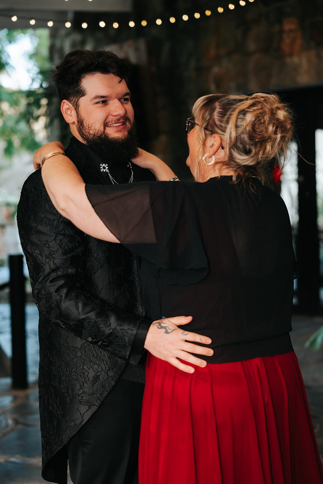 Jordan dancing with his mum in her red dress