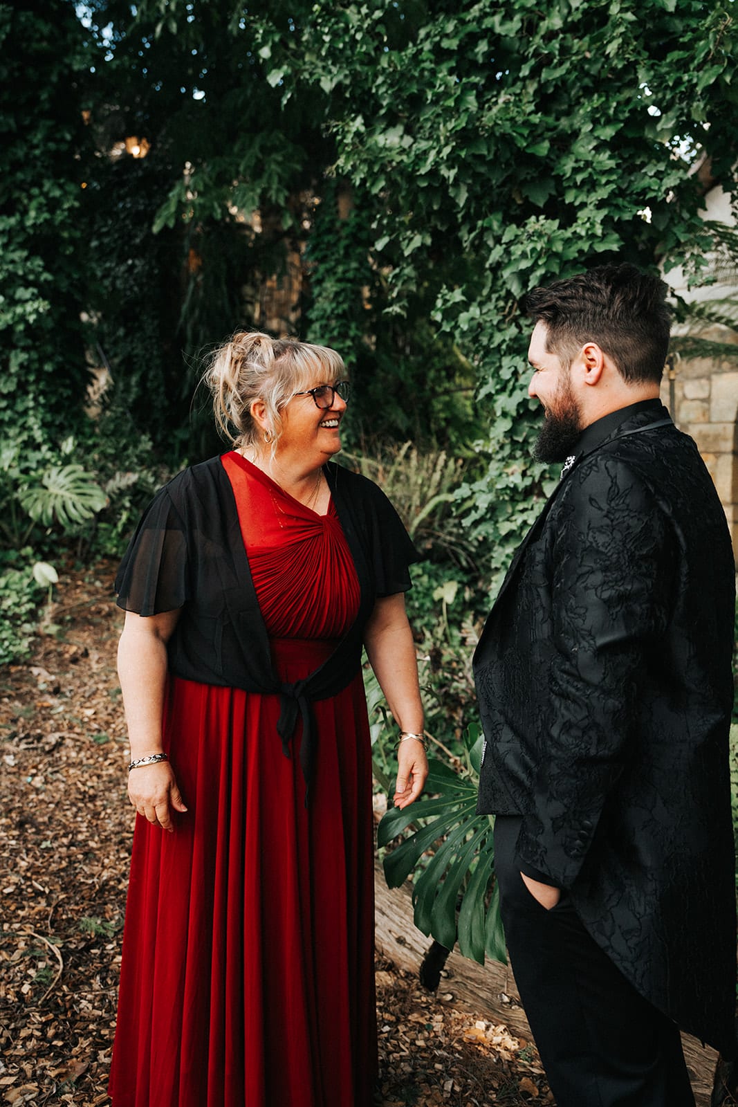 Jordan’s mum in a red dress beaming at him during their first look
